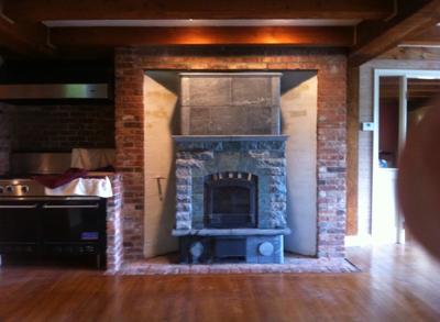 Tulikivi Heater Installed in Converted Open Masonry Fireplace. Used Fireplace Moved from Jamestown, Rhode Island to Concord, New Hampshire.